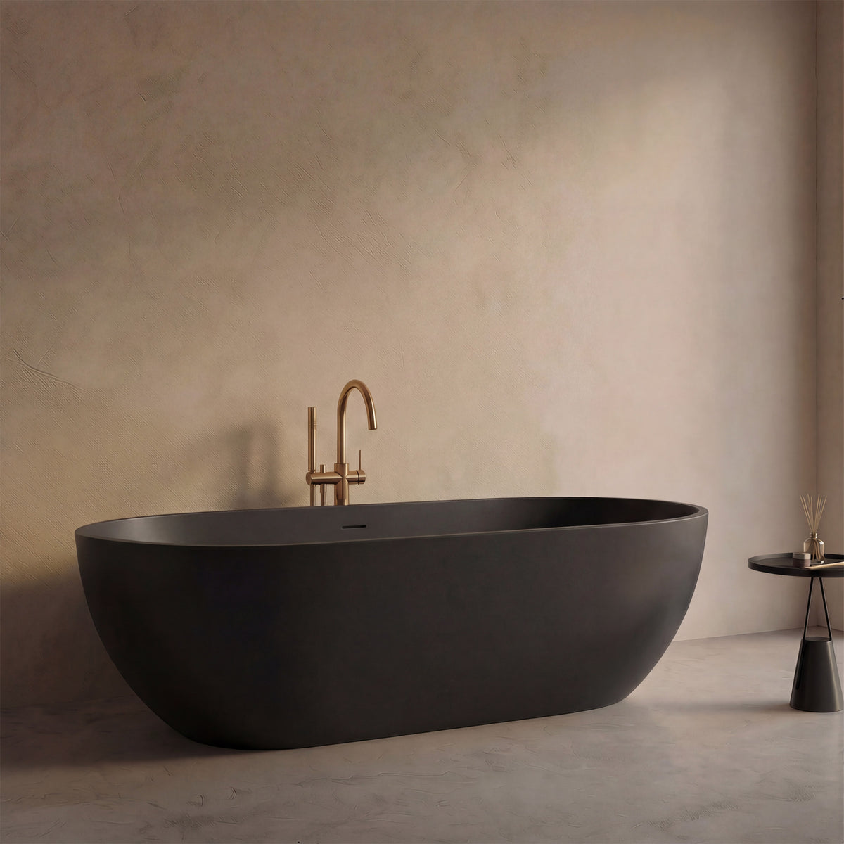AURELLE 69-inch matte black oval bathtub, close side view with brushed gold floor faucet
