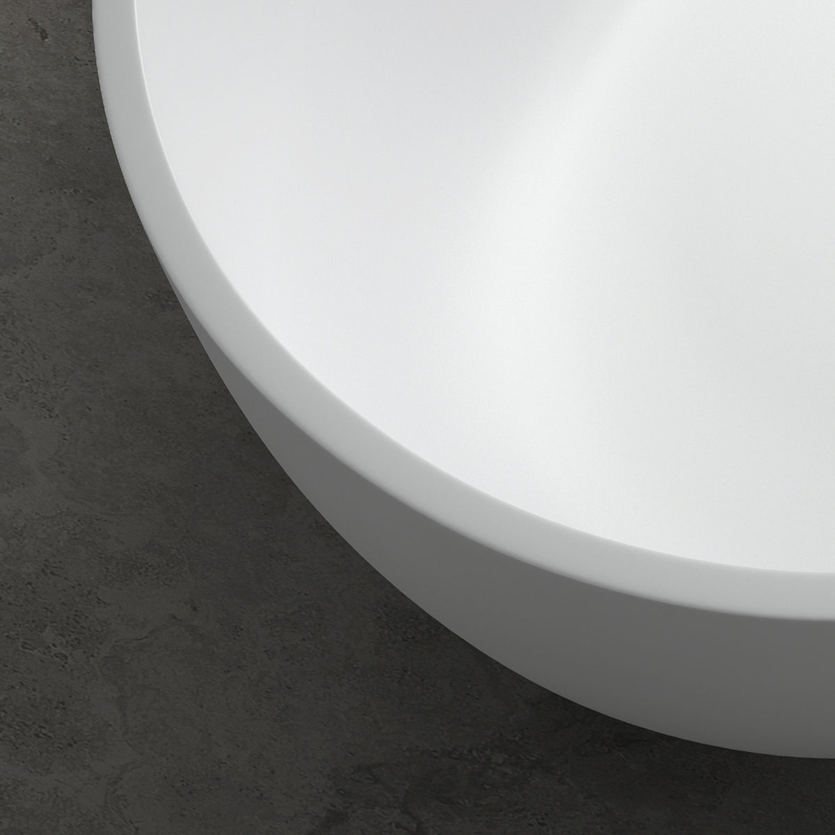 AURELLE 69-inch minimalist oval freestanding solid surface bathtub with smooth white rim against dark floor