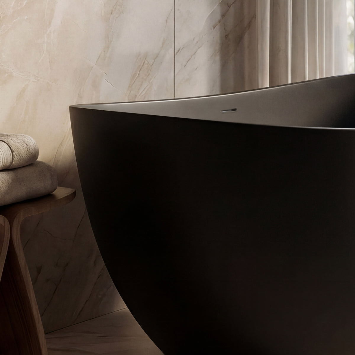 CALMAE 65-inch freestanding solid surface soaking bathtub with matte black exterior and white interior