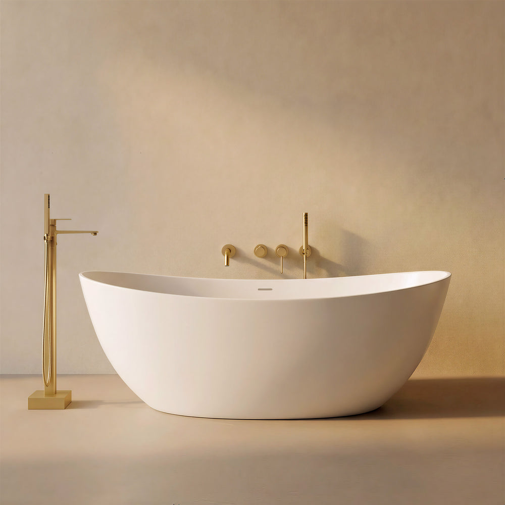 CALMAE 65-inch freestanding solid surface soaking bathtub in white oval shape with brushed gold floor-mounted faucet