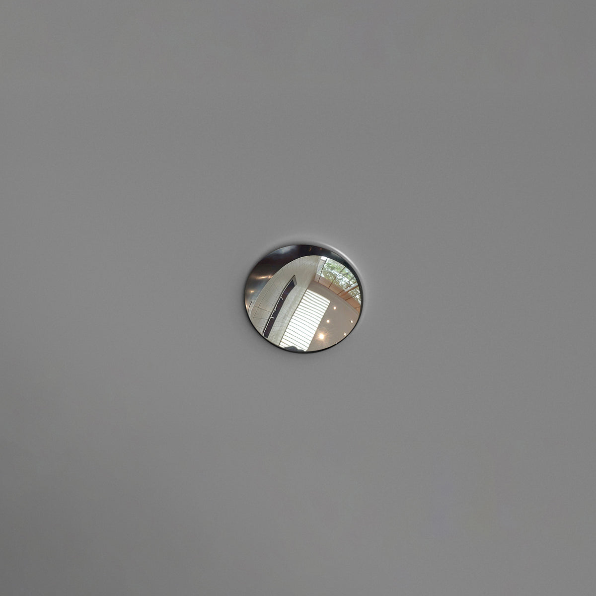 OBSIDIAN freestanding solid surface soaking bathtub with chrome overflow drain detail