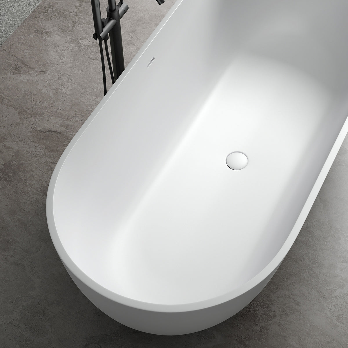 OBSIDIAN freestanding solid surface soaking bathtub, oval white tub with centered drain, top-down view